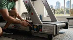 A photorealistic close-up view showing the sophisticated shock-absorption system, complete with elastomeric cushions and springs, under a treadmill running deck. (Illustration 2)